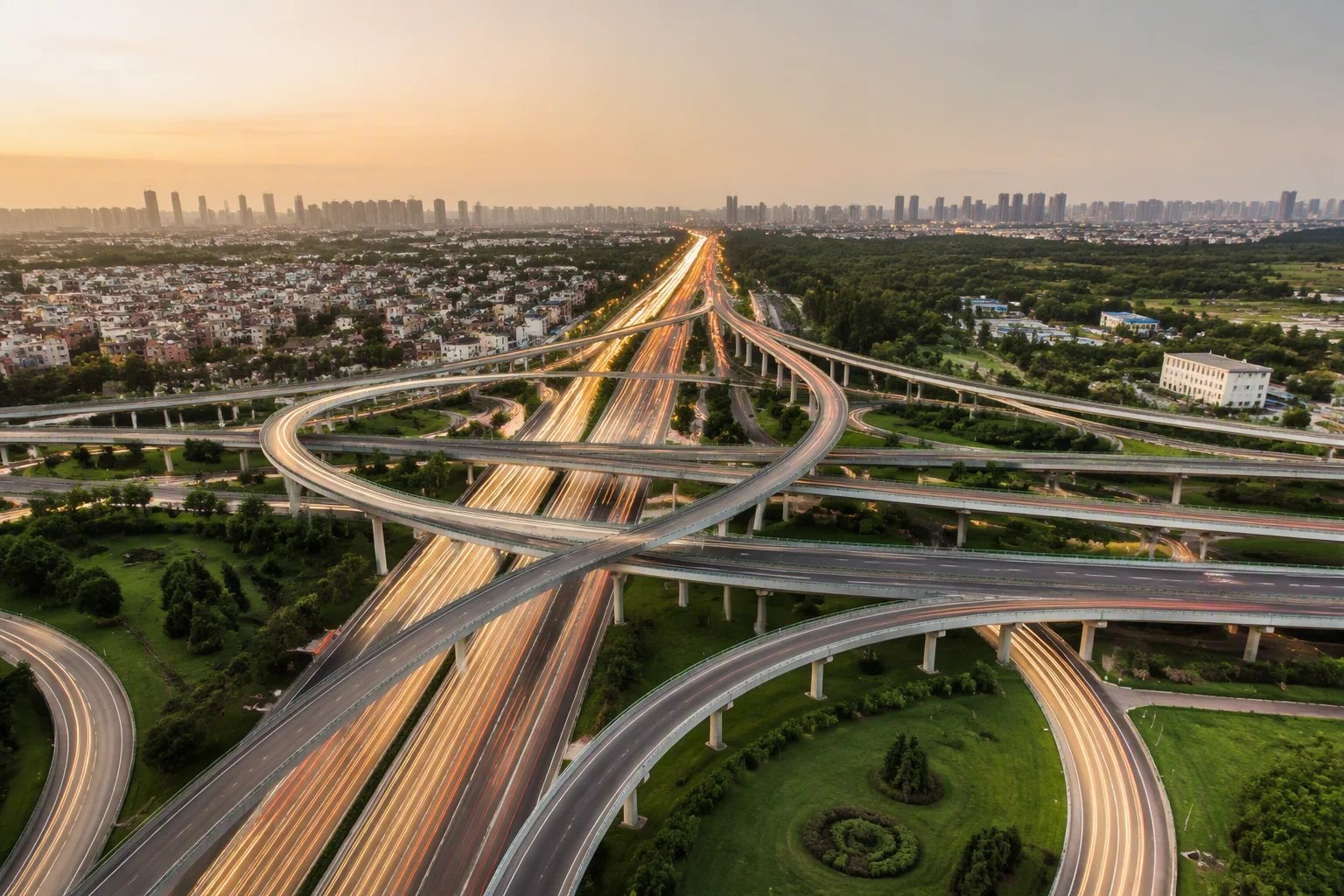 Highway interchange at dusk with light trails